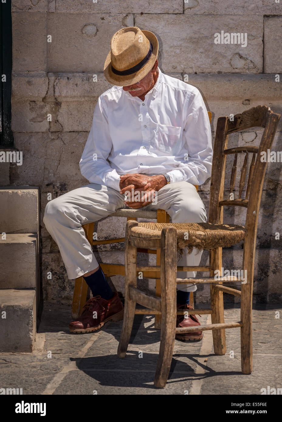 Elderly Greek taking a nap, Chania, Crete, Greece Stock Photo