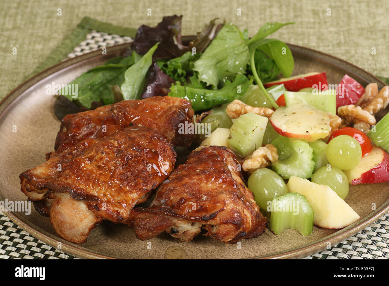 Roast chicken thighs with a mixed salad Stock Photo Alamy