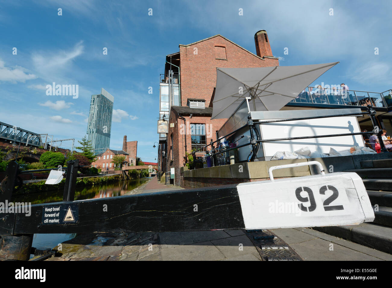 The Castlefield historic inner city canal area including Dukes 92 and lock and Beetham Tower (background) in Manchester UK Stock Photo
