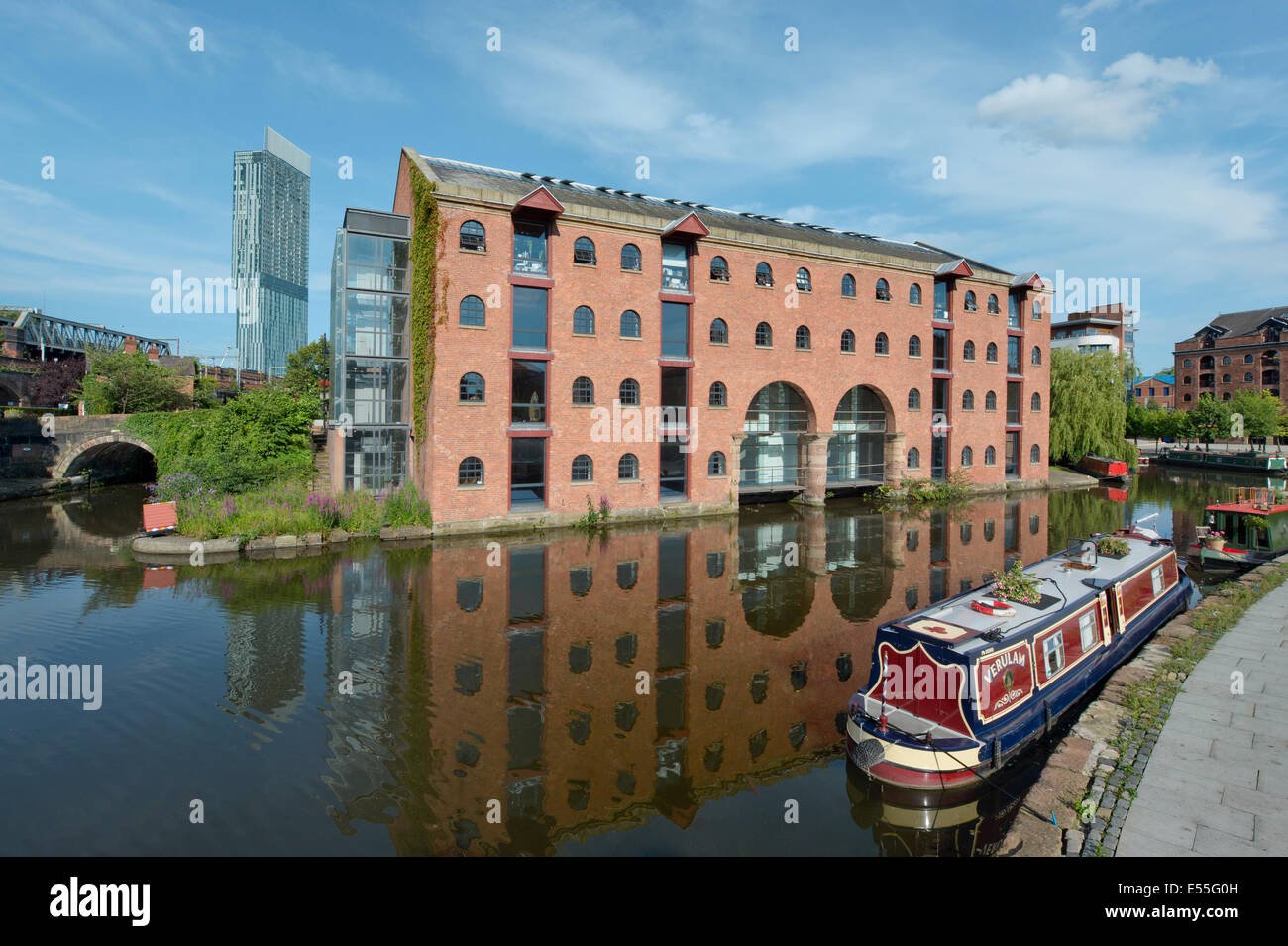 The Castlefield Urban Heritage Park and historic inner city canal conservation area with Beetham Tower in Manchester, UK. Stock Photo