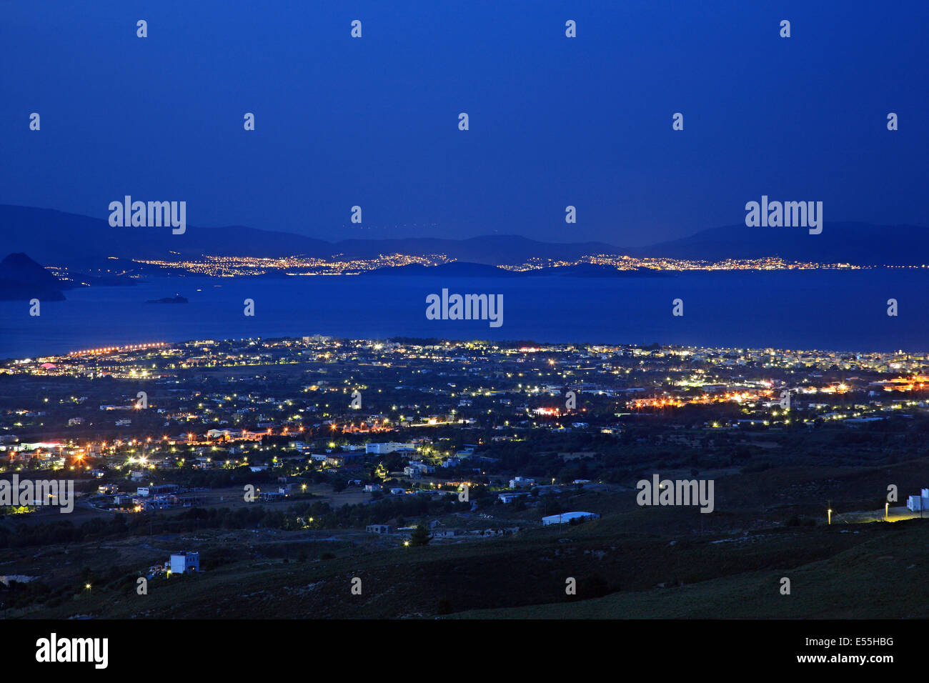 Night view of Kos town, Kos island, Dodecanese, Aegean sea, Greece. In the background the Turkish coast. Stock Photo
