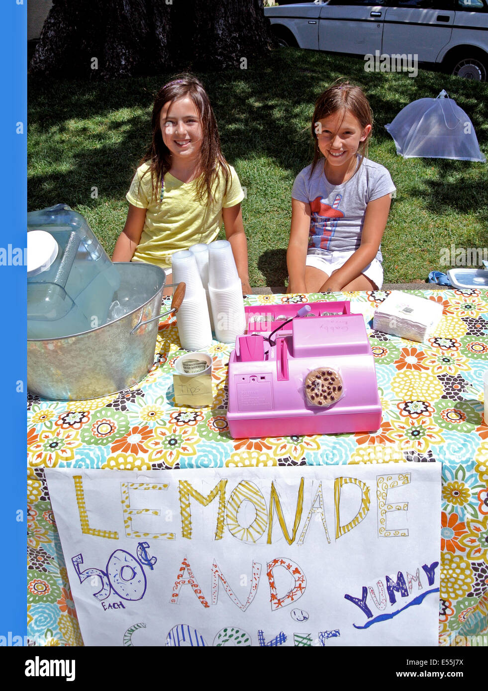 two girls selling lemonade and cookies on Larkspur California Street Stock Photo
