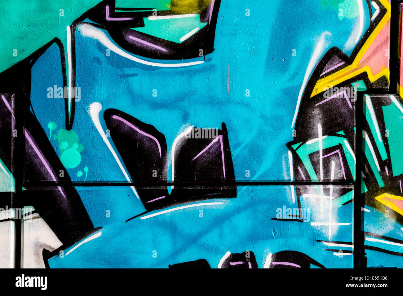 Blue ice, colorful graffiti, abstract grunge grafiti background over textured wall Stock Photo