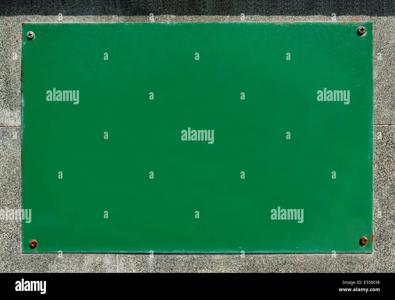 Green blank billboard on the stone wall background Stock Photo - Alamy