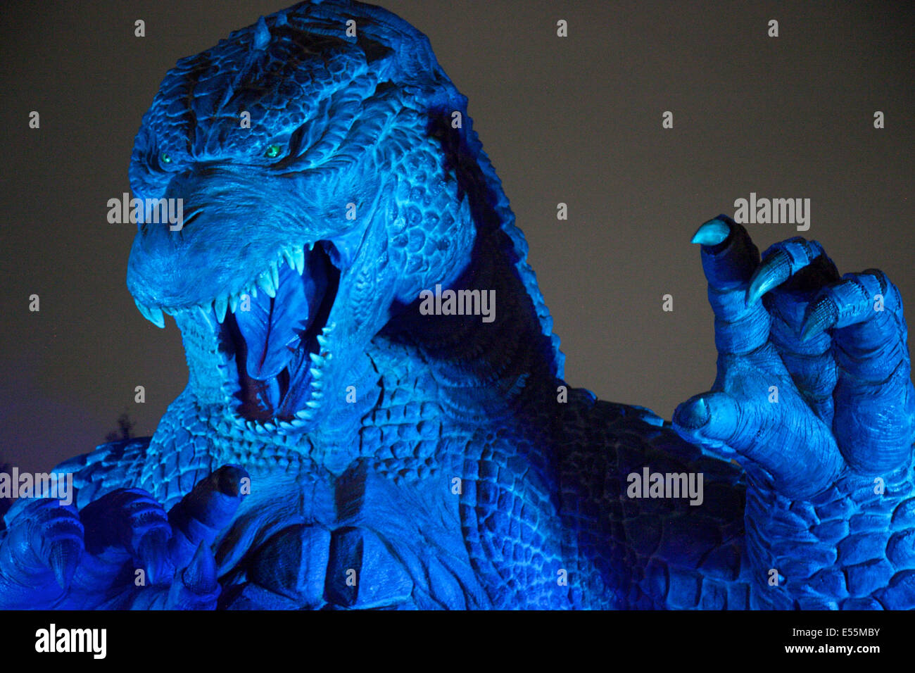 Tokyo, Japan. 18th July, 2014. A 6.6 meter model of the new Godzilla is displayed at Tokyo Midtown on July 18, 2014, Tokyo. The statue is a 1/7 scale reproduction of the 180 meters tall Hollywood film version of 'GODZILLA'. Godzilla and its footprints will be displayed from July 18 to August 31 during which time it will perform a special show using mist, light and sound effects every 30 minutes between 19:00 to 21:00. © Rodrigo Reyes Marin/AFLO/Alamy Live News Stock Photo