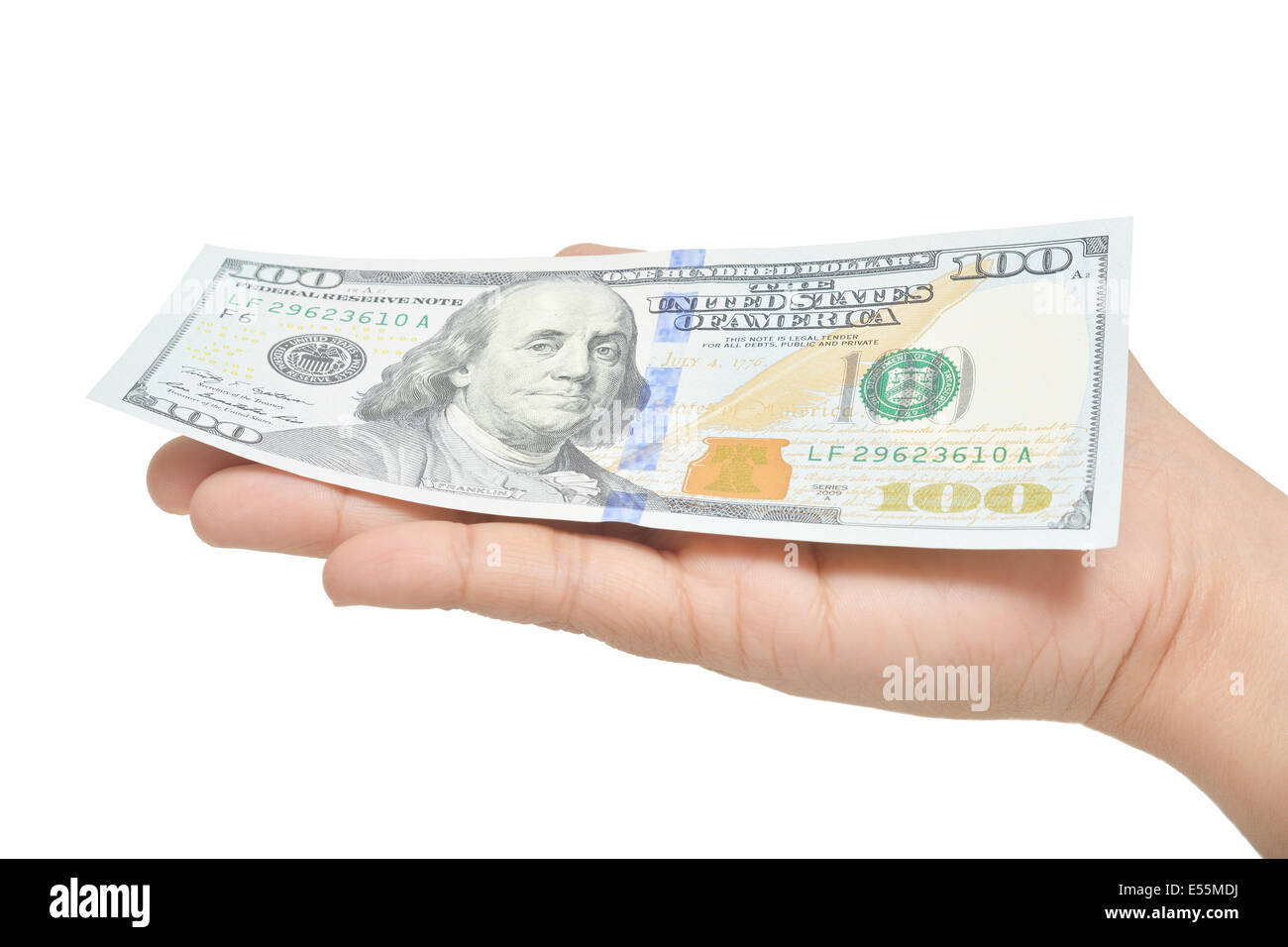 One hundred dollars in the palm of the hand, on a white background. Stock Photo