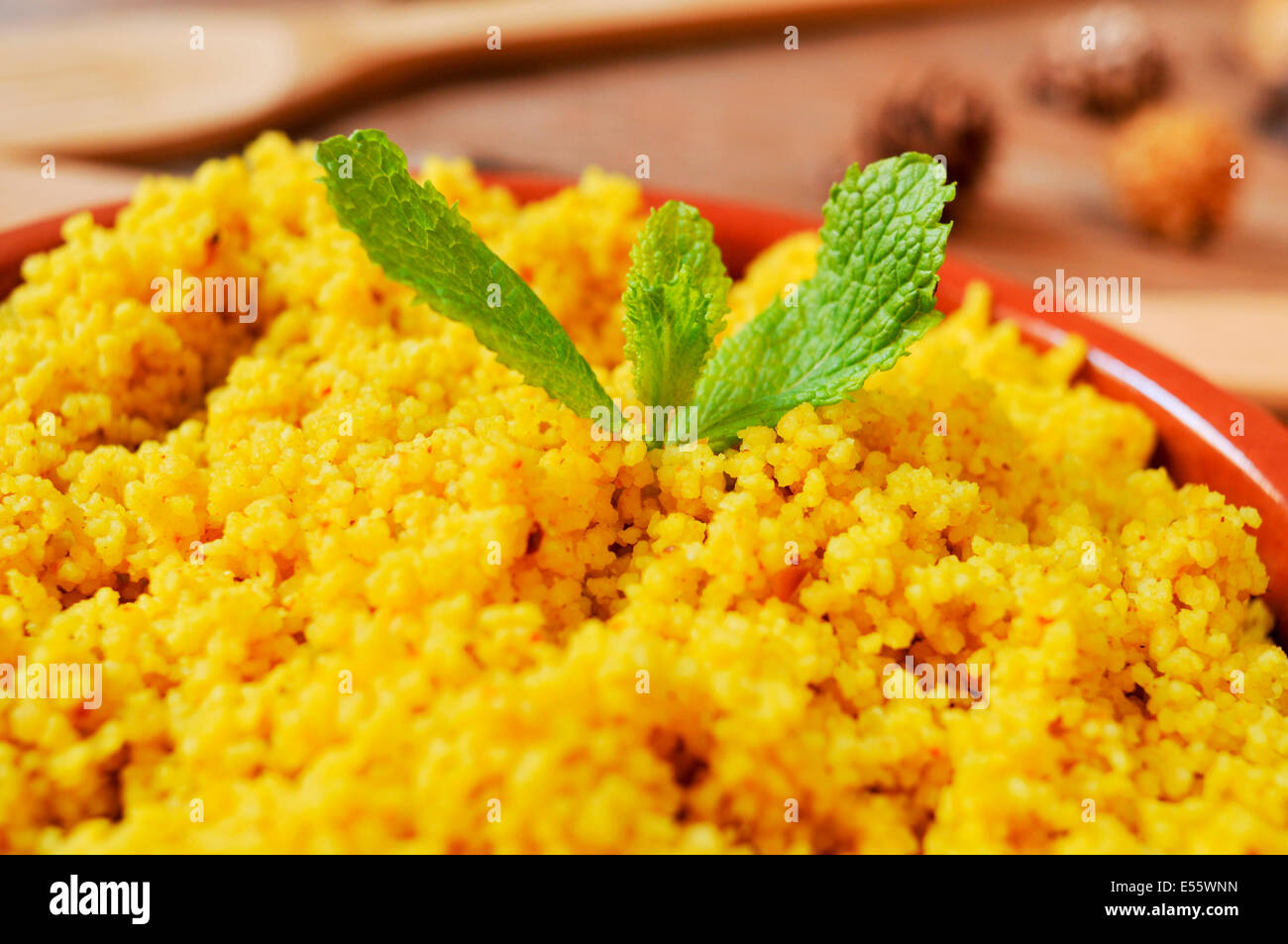 closeup of an earthenware casserole whit spiced couscous Stock Photo
