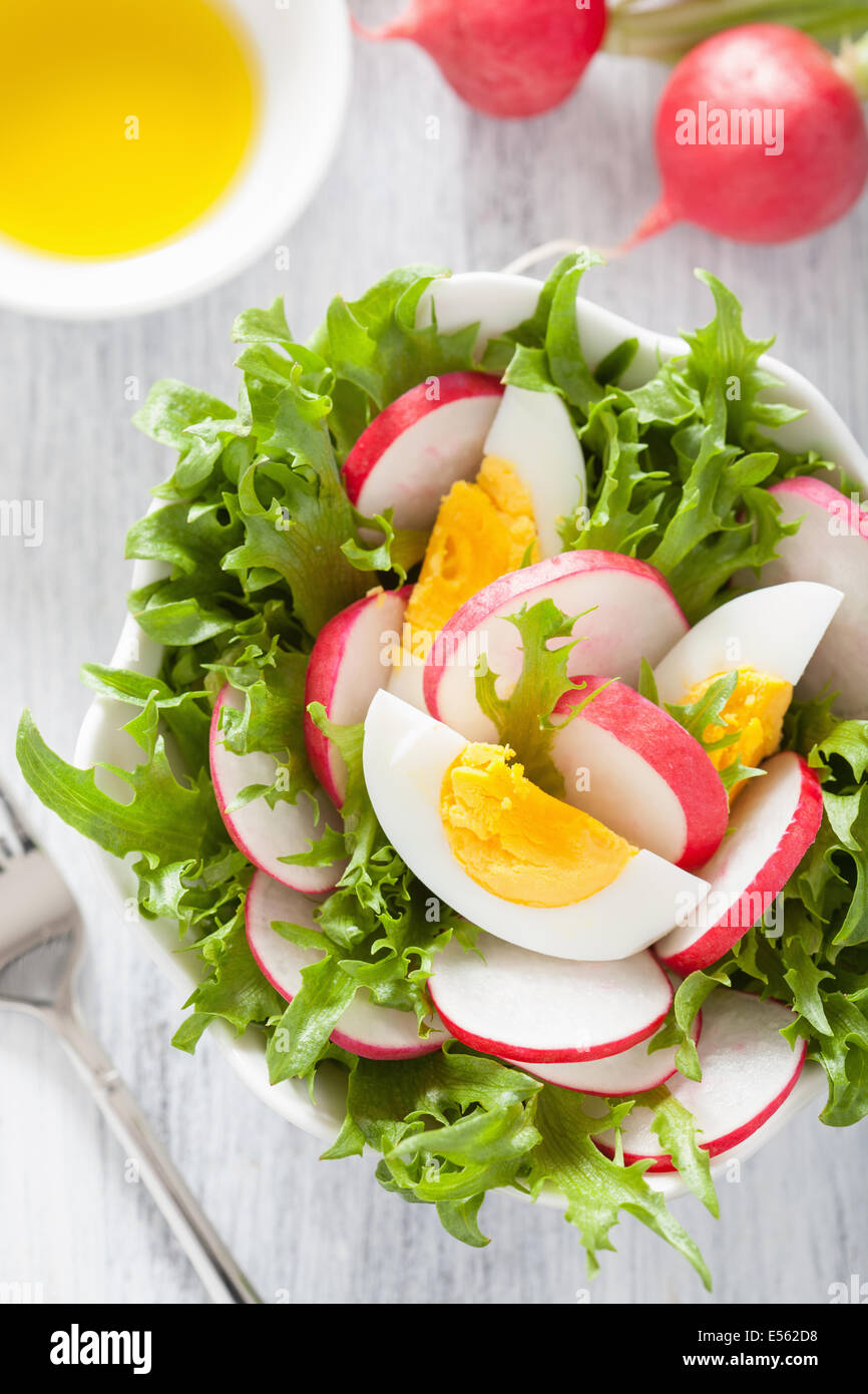 healthy salad with egg radish and green leaves Stock Photo