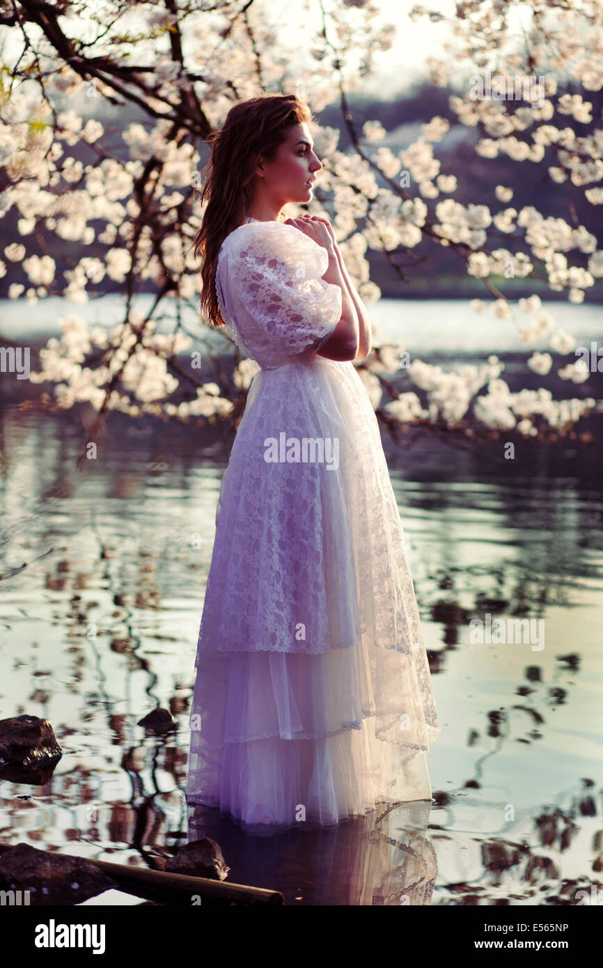 Portrait of a young woman with cherry blossoms Stock Photo