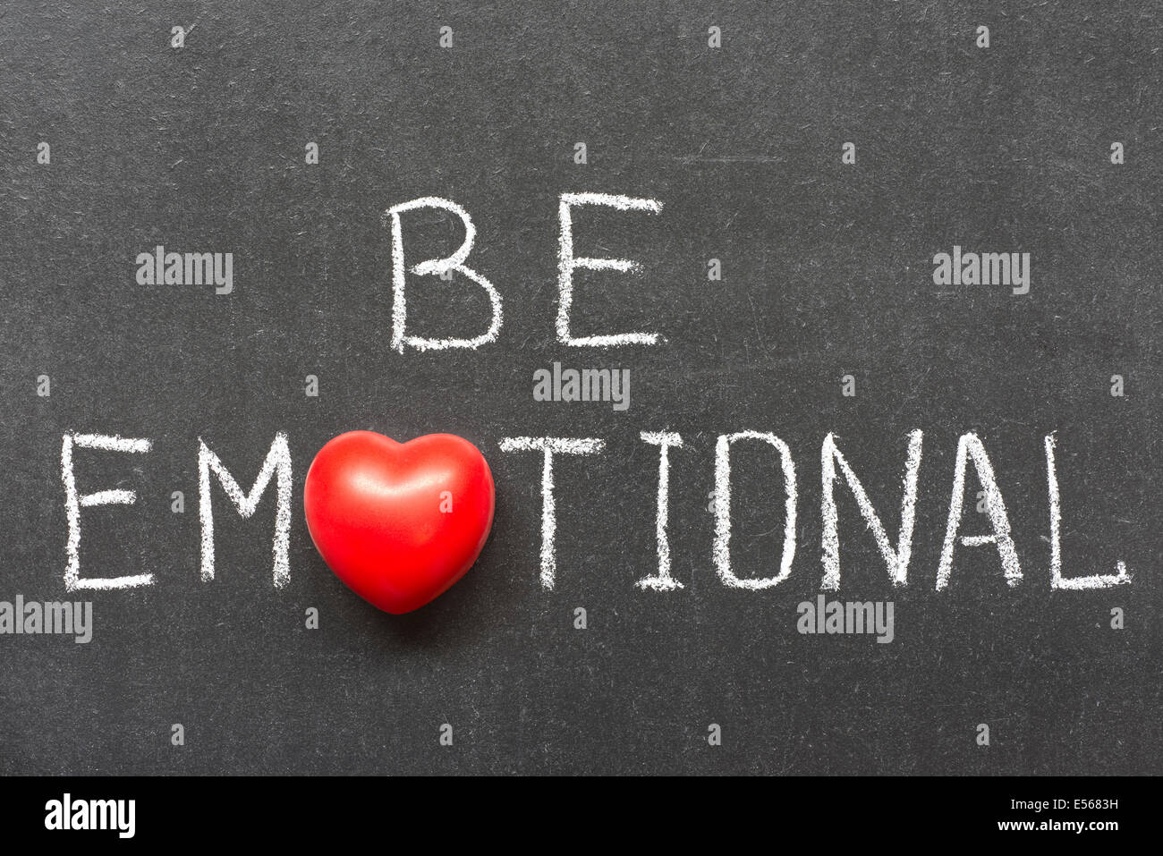 be emotional phrase handwritten on chalkboard with heart symbol instead of O Stock Photo