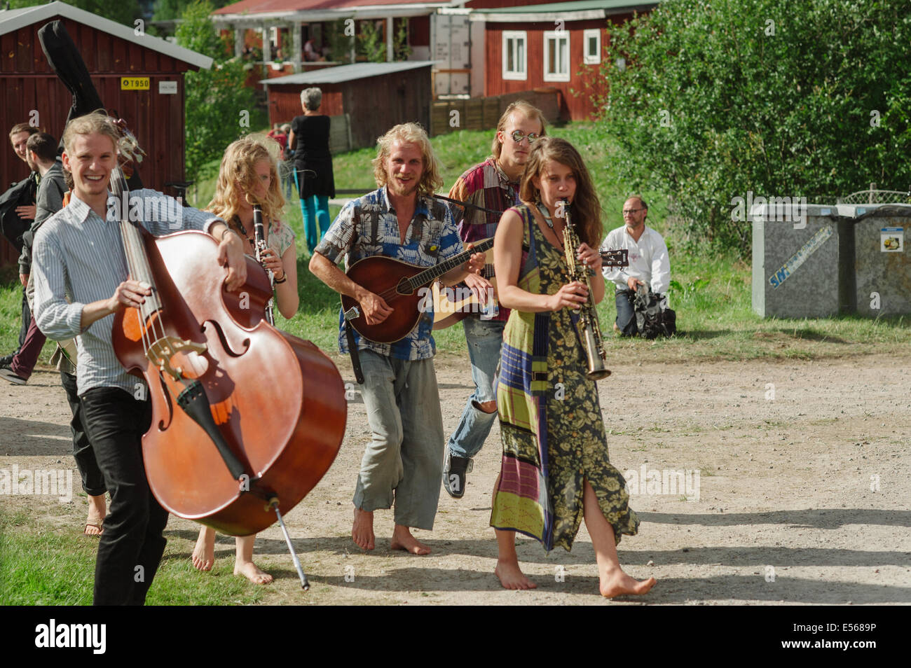 Young happy musicians at the famous traditional folk music festival in Bingsjo, Sweden. Stock Photo