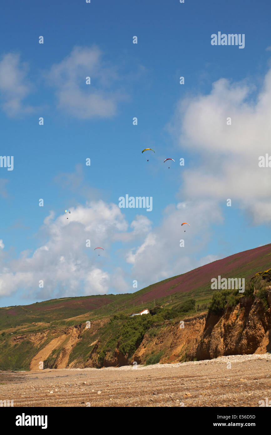 parascending over the cliffs of the beach at Vauville, Normandy, France in July Stock Photo