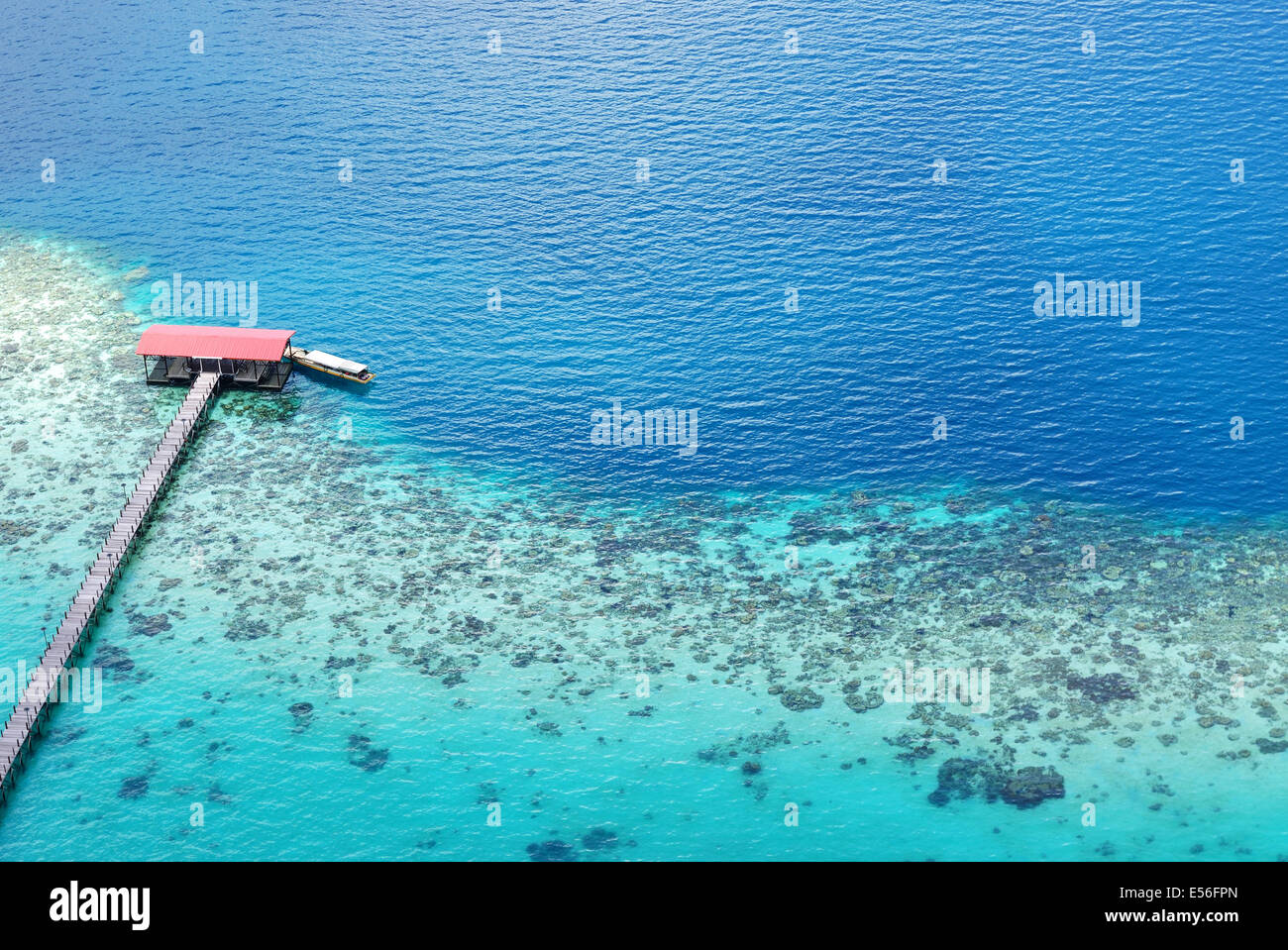 Scenic aerial view of an ocean with jetty and coral, Tun Sakaran Dandai Marine park, Sabah Borneo Stock Photo