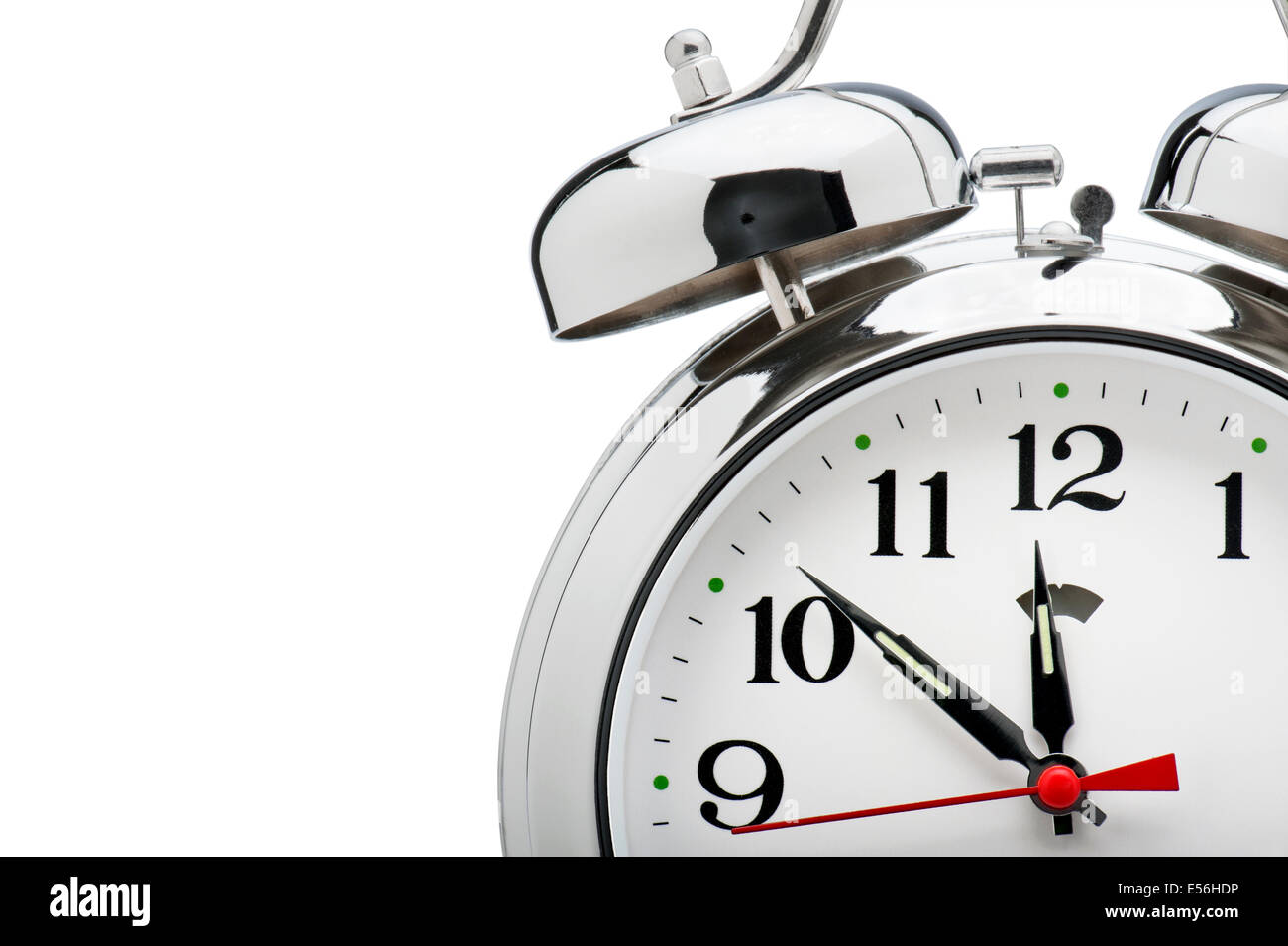 detail of vintage alarm clock on white background Stock Photo - Alamy