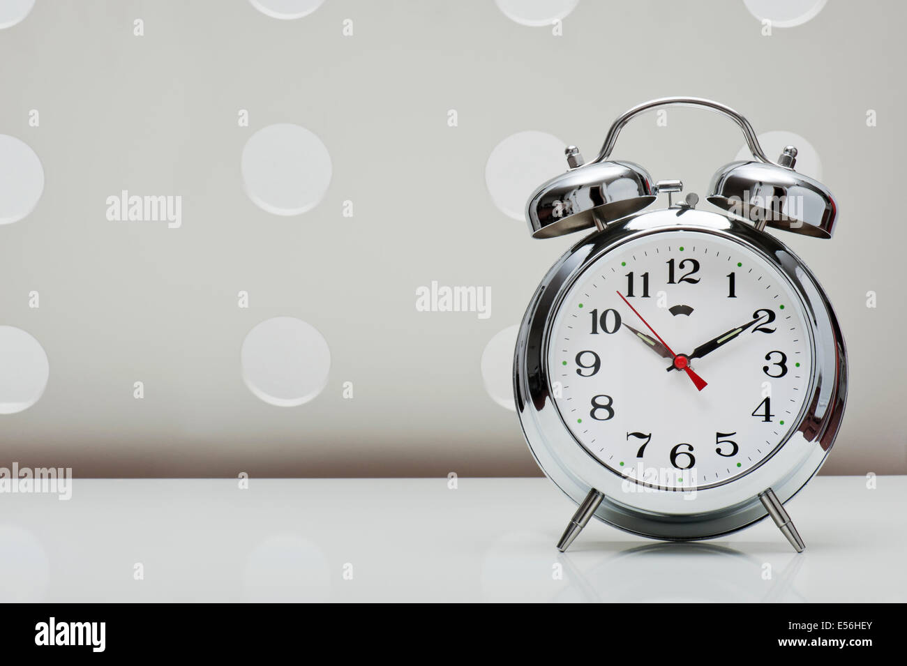 classical alarm clock on vintage background Stock Photo Alamy