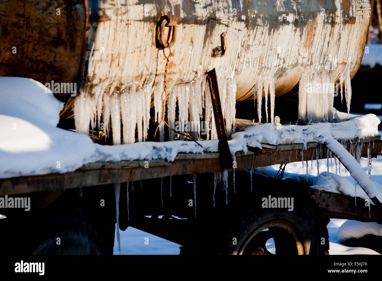 frozen farm machinery icicles snow rusty Stock Photo