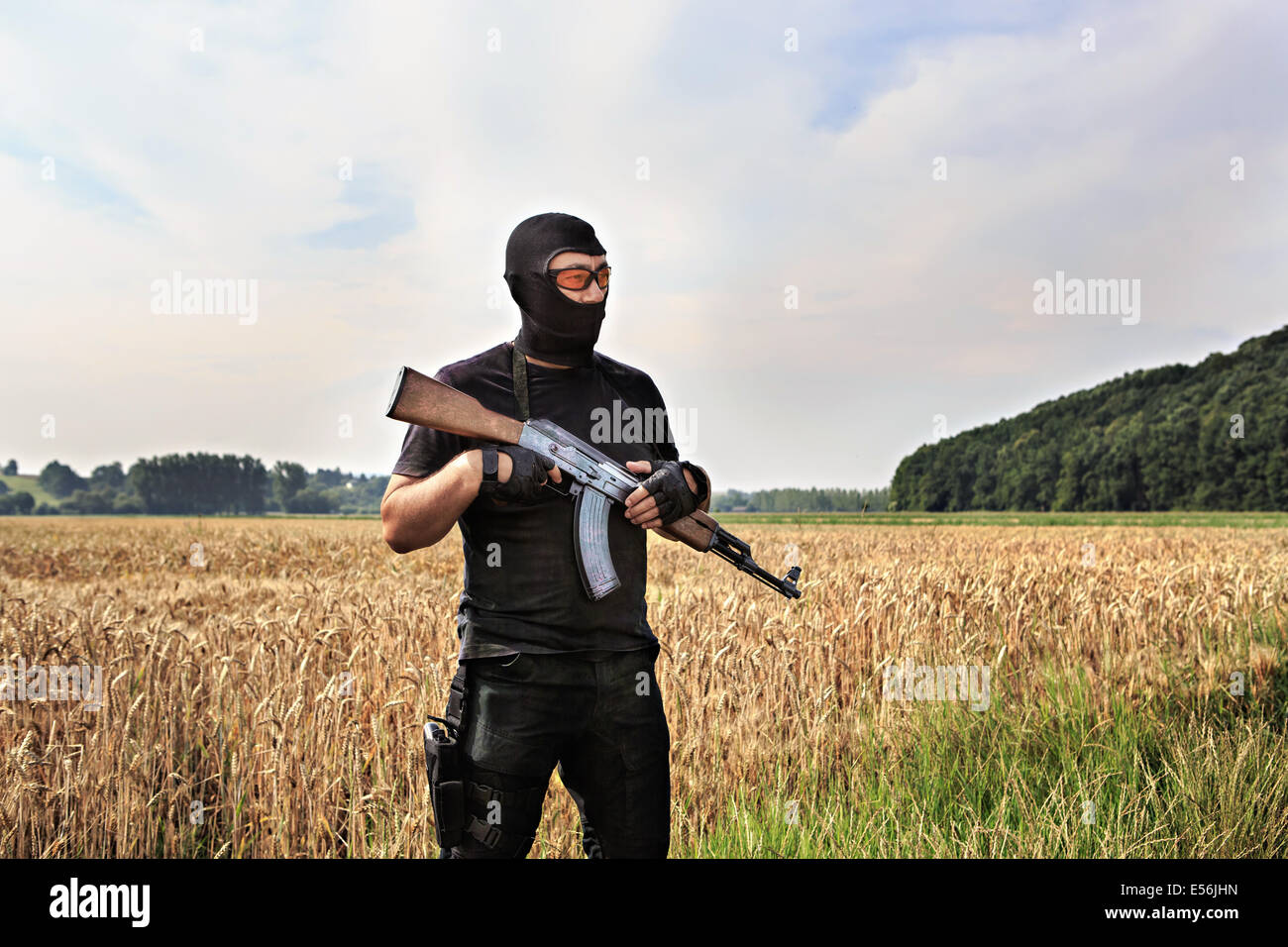 masked militant with a submachine gun by tactical operation Stock Photo