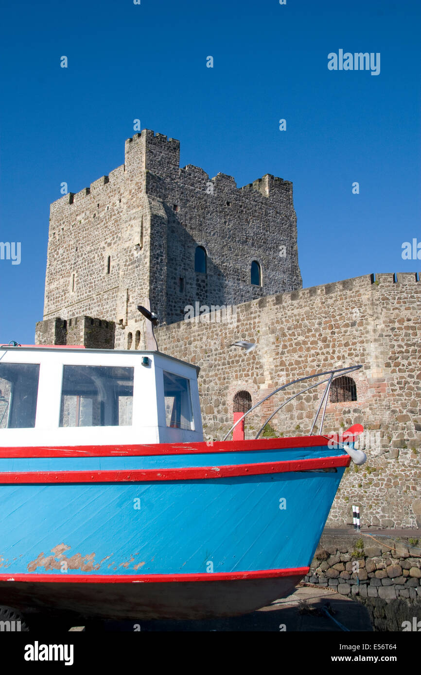 The Norman Keep of Carrickfergus Castle with fishing boat Stock Photo