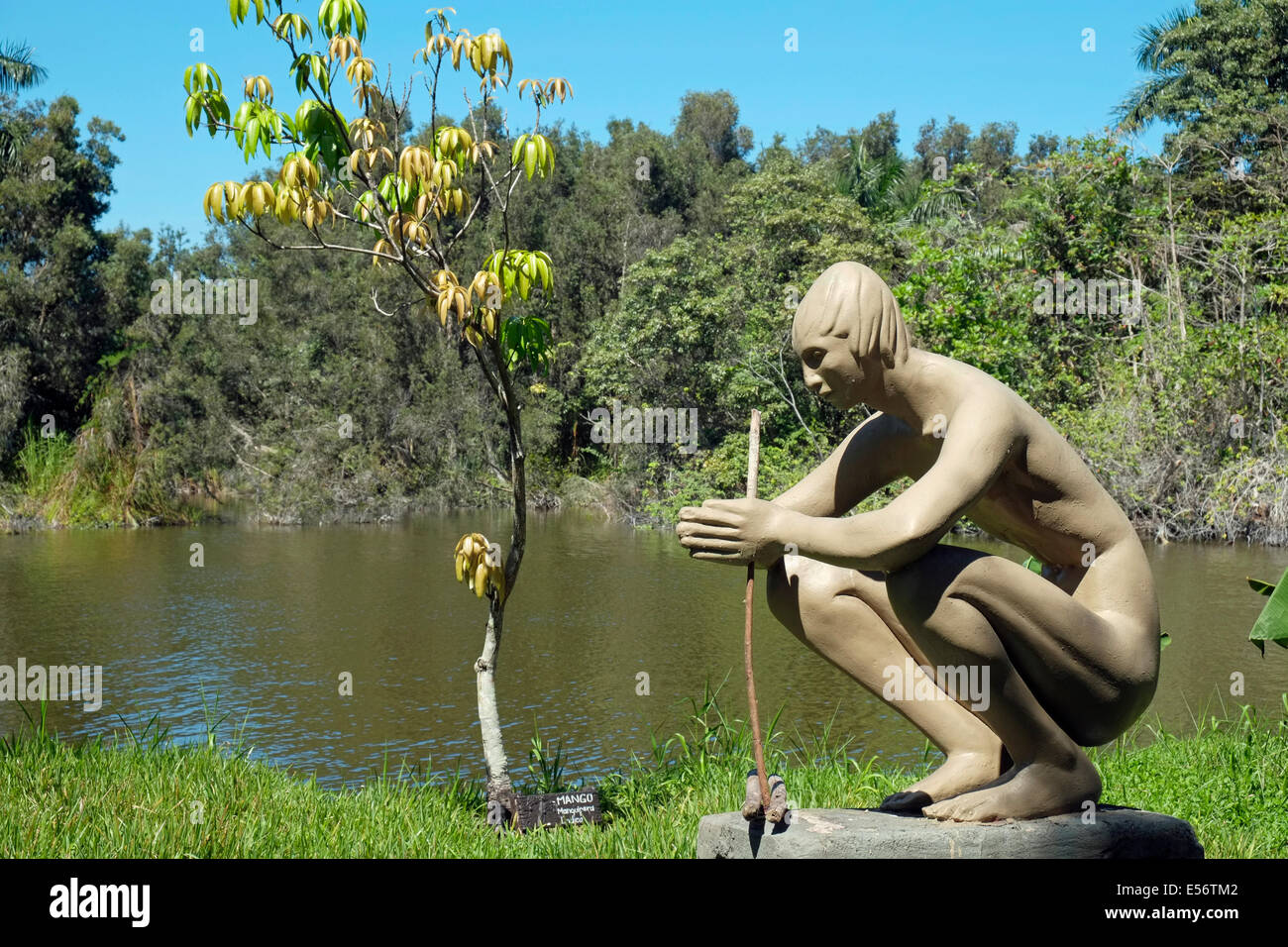 Sculpture of a boy lighting a fire at the reconstructed Indian village at Guamá on the Zapata swamp, Cuba. Stock Photo
