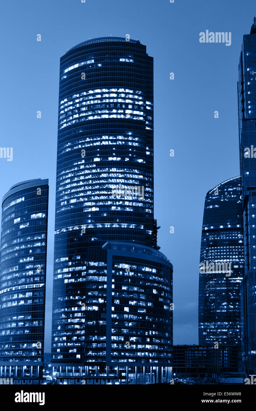 Modern skyscrapers at night toned in a blue color Stock Photo - Alamy