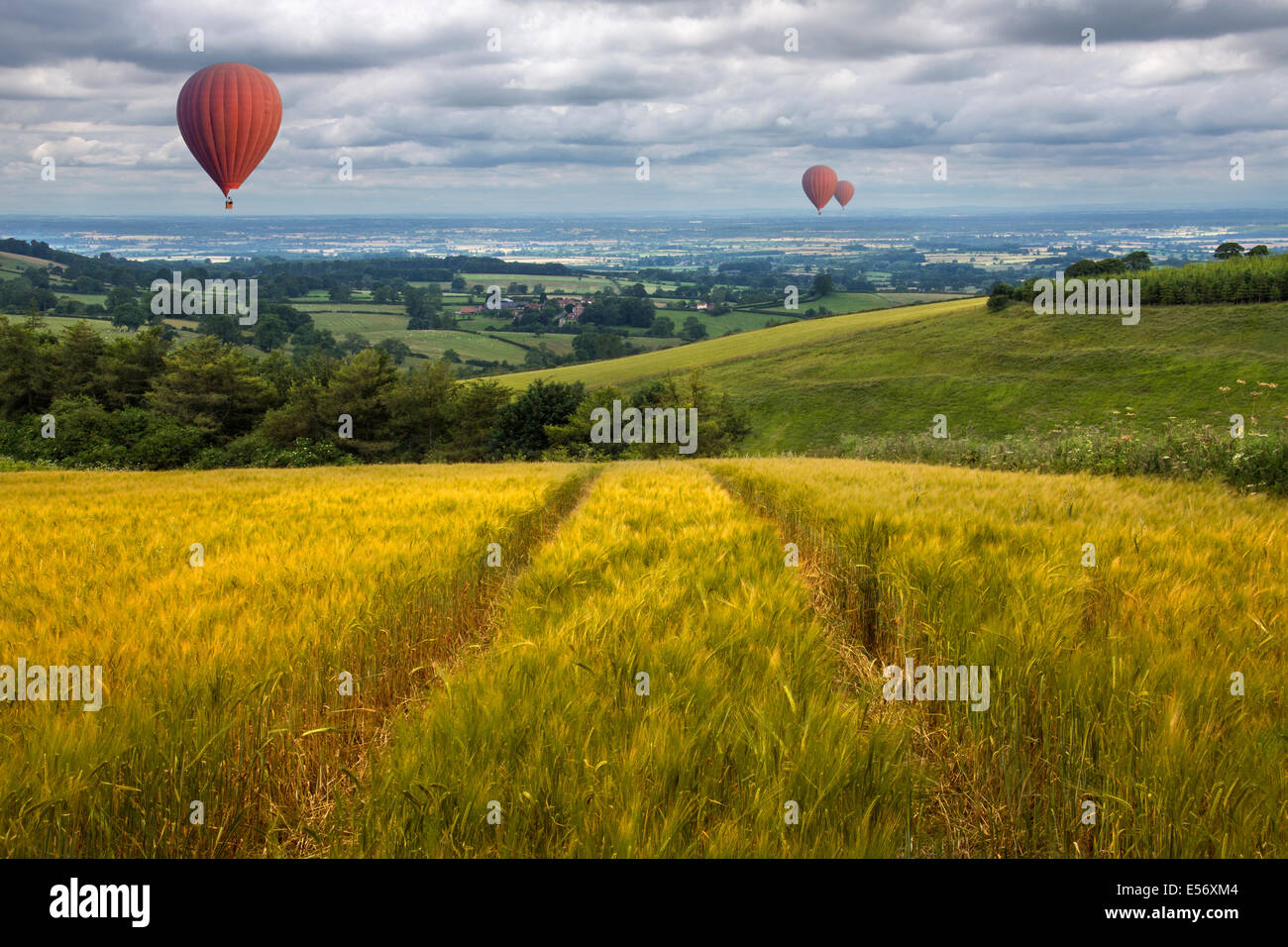 Hot air balloons drifting over fields and meadows of the East Yorkshire Wolds in the United Kingdom Stock Photo