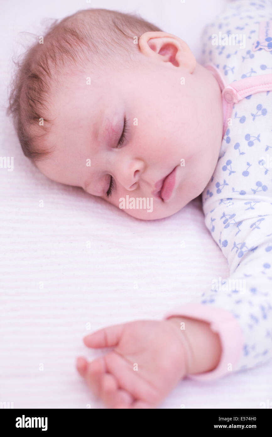 Cute baby girl sleeping in her crib Stock Photo Alamy