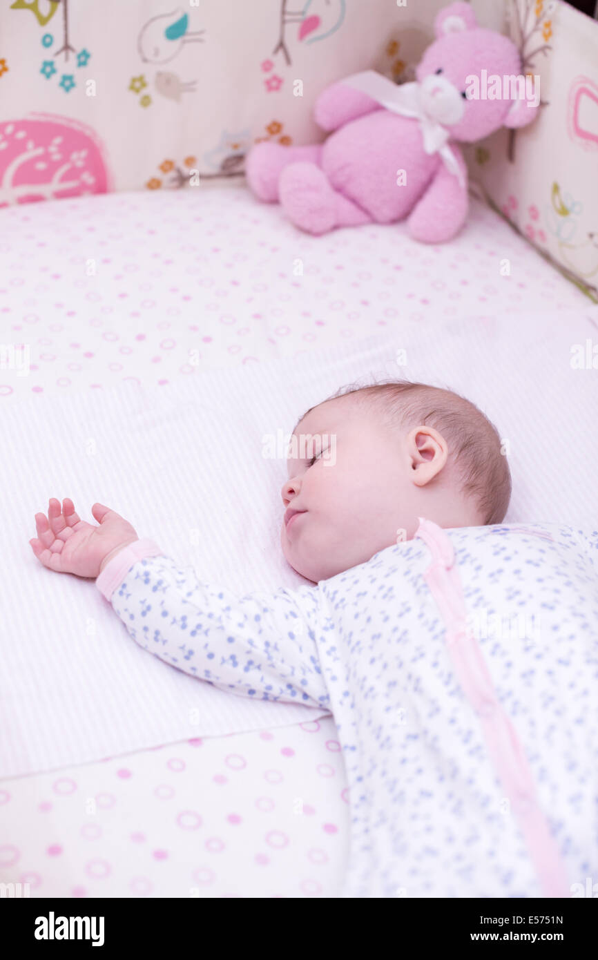 Cute baby girl sleeping in her crib Stock Photo Alamy