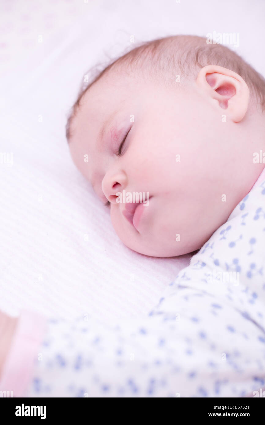 Cute baby girl sleeping in her crib Stock Photo Alamy