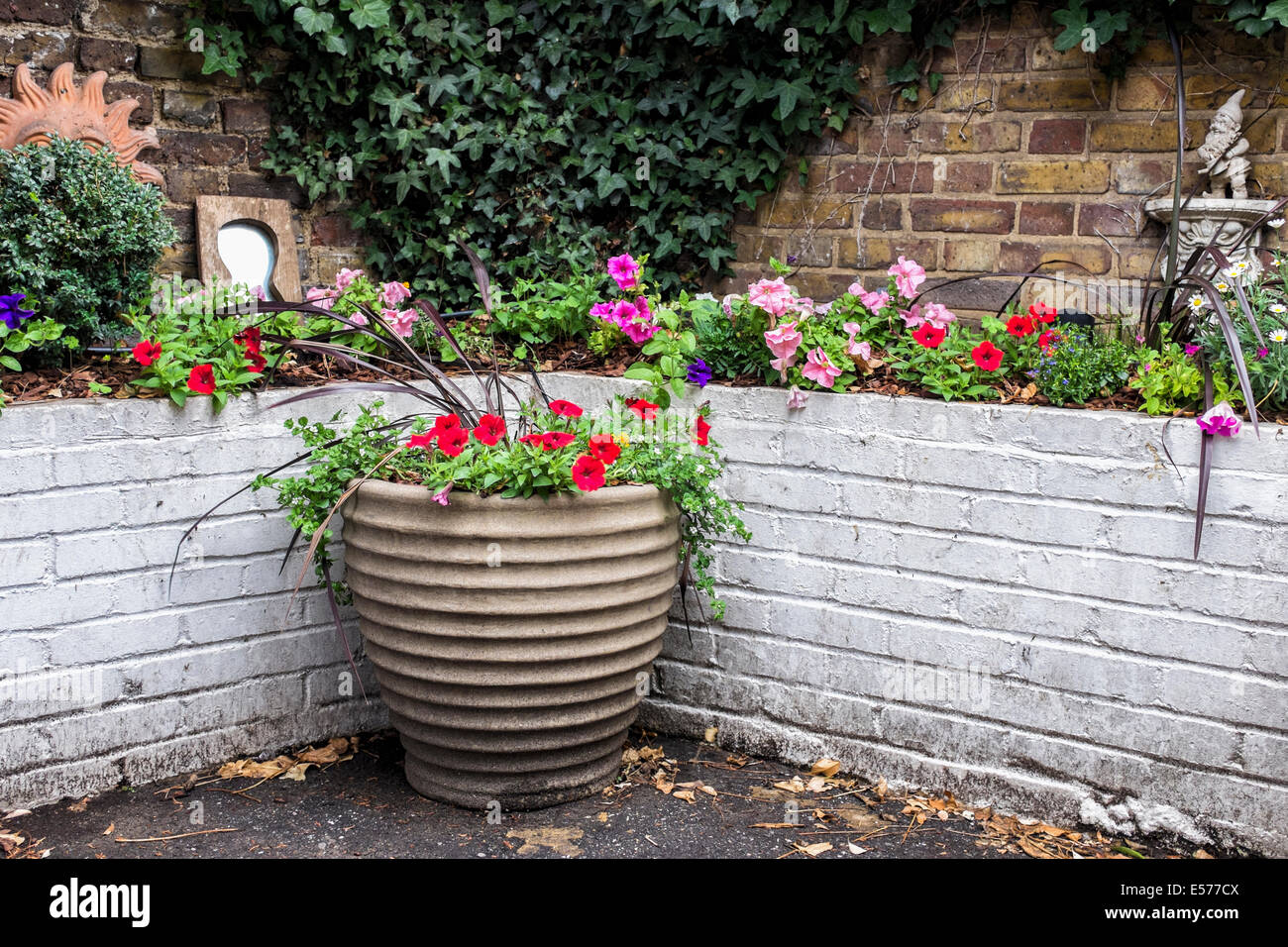 The Pelton Arms traditional pub - outside the pub is a welcoming garden, pot plants,mirrors and ornaments  - Greenwich,UK Stock Photo