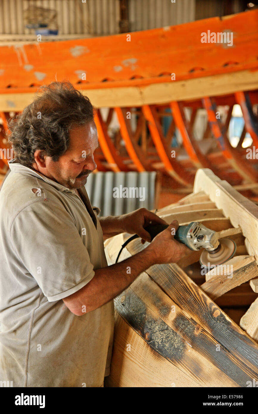 Mr. Panagiotis Ioannou, traditional shipbuilder in his shipyard at Ierissos, Halkidiki ('Chalkidiki'), Macedonia, Greece Stock Photo