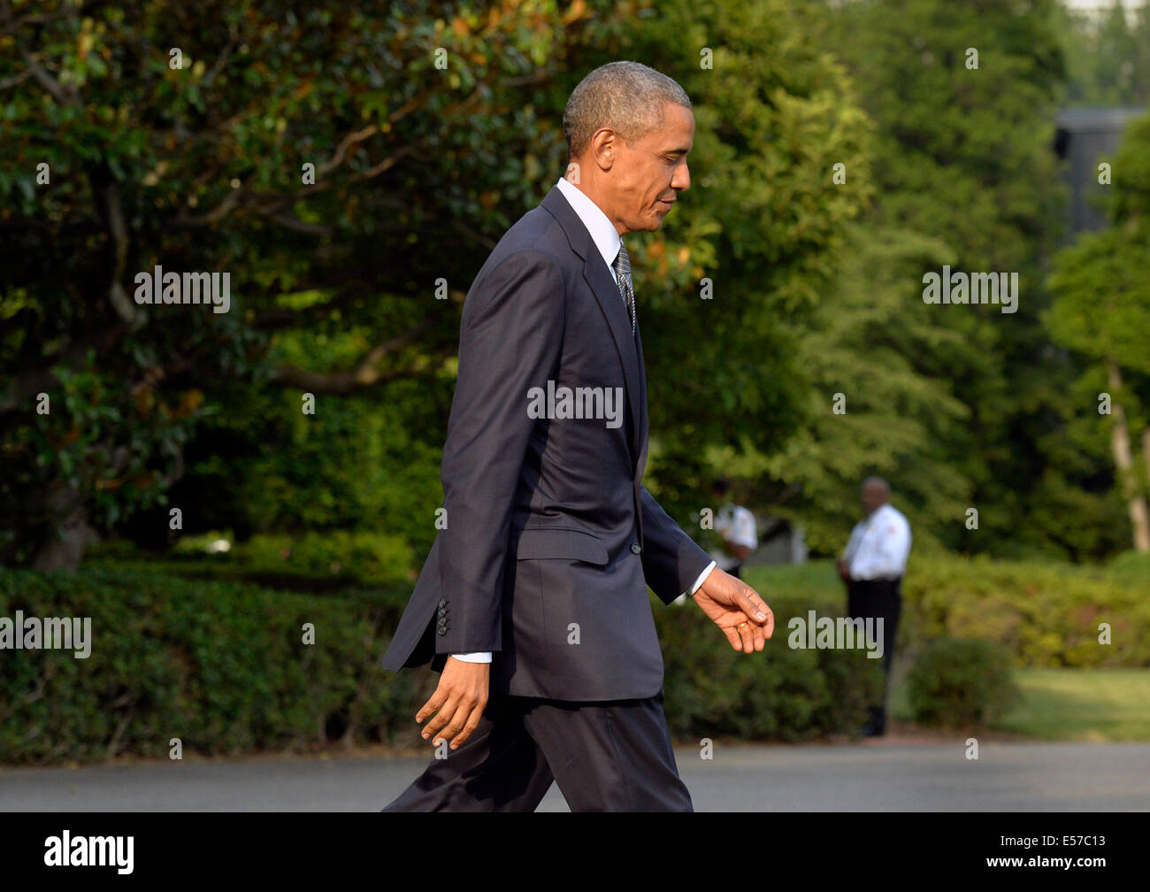 United States President Barack Obama departs the White House for a weekend trip to Camp David, the Presidential retreat near Thurmont, Maryland, Friday, July 18, 2014 in Washington, DC Credit: Kevin Dietsch/Pool via CNP Stock Photo