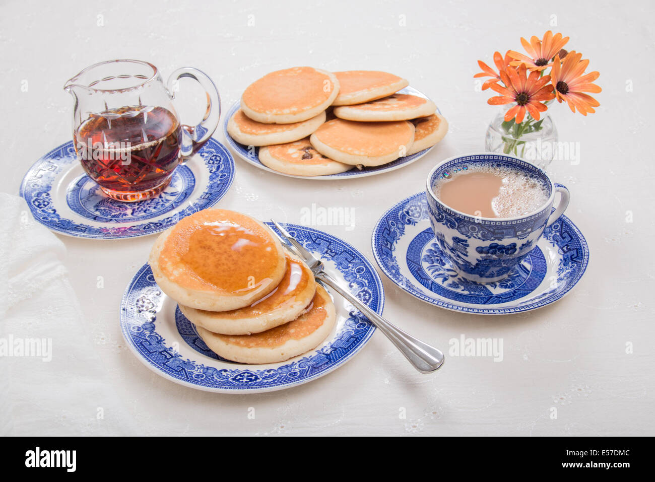 Scotch pancakes with maple syrup and a cup of tea willow pattern