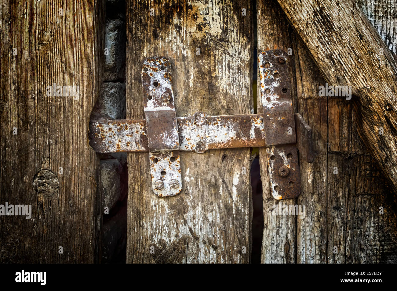 Old latch on the old wooden door. Stock Photo