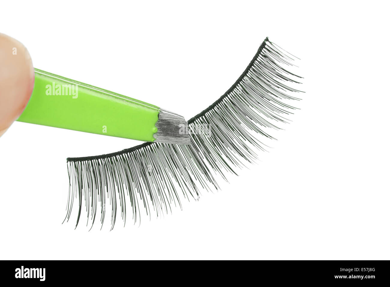 False lashes and green pincers, closeup on white background Stock Photo