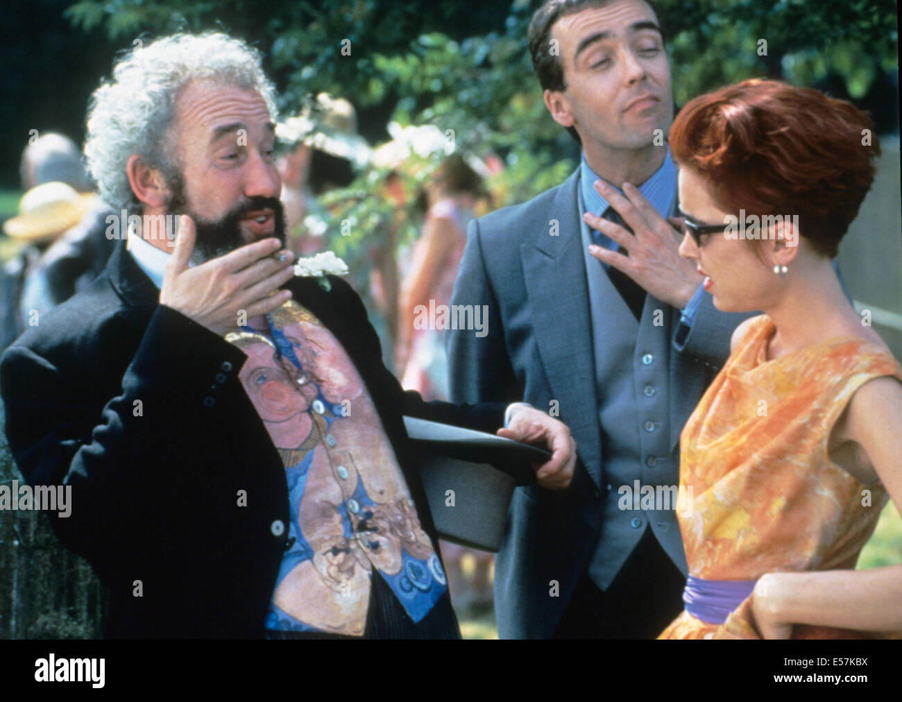FOUR WEDDINGS AND A FUNERAL 1994 PolyGram/Working Title film with from l: Simon Callow, John Hannah, Charlotte Coleman Stock Photo