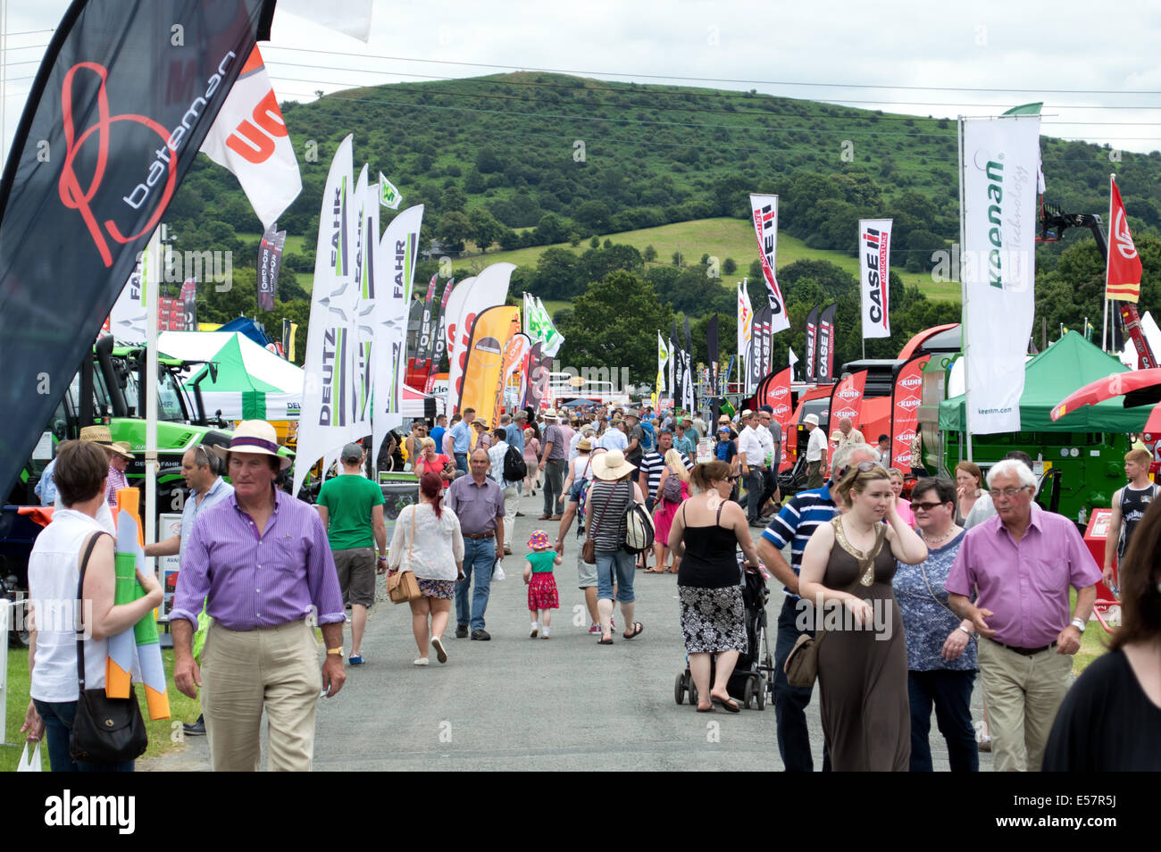 Crowd passing through tractor machinery stands at the Royal Welsh Show 2014 Stock Photo