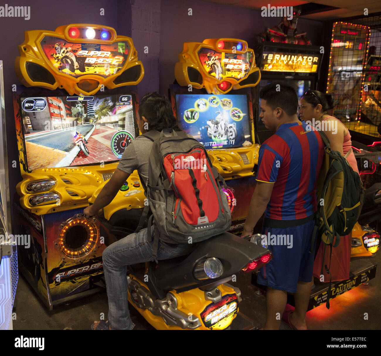 Coney Island; Video game arcades with violent games are popular with with adolescent and teenage boys along with some adults Stock Photo