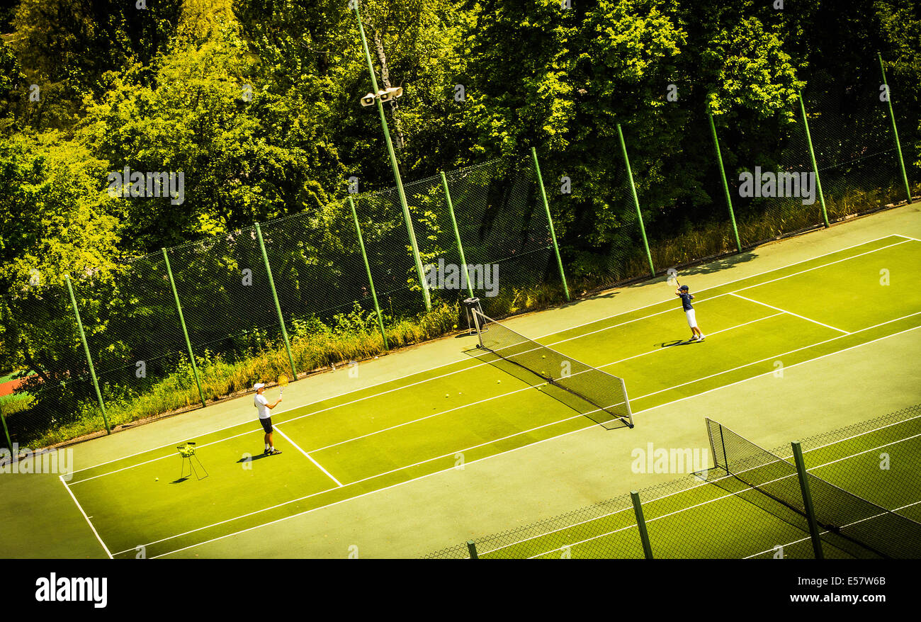Tennis game on green court. Poland Stock Photo
