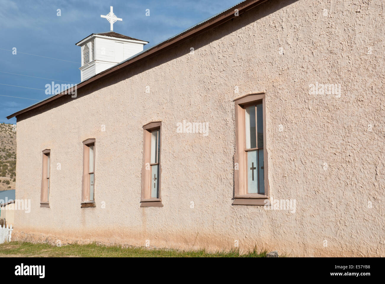 This charming Catholic church is one of only a few buildings in the town of Lincoln, where Billy the kid made his escape. Stock Photo