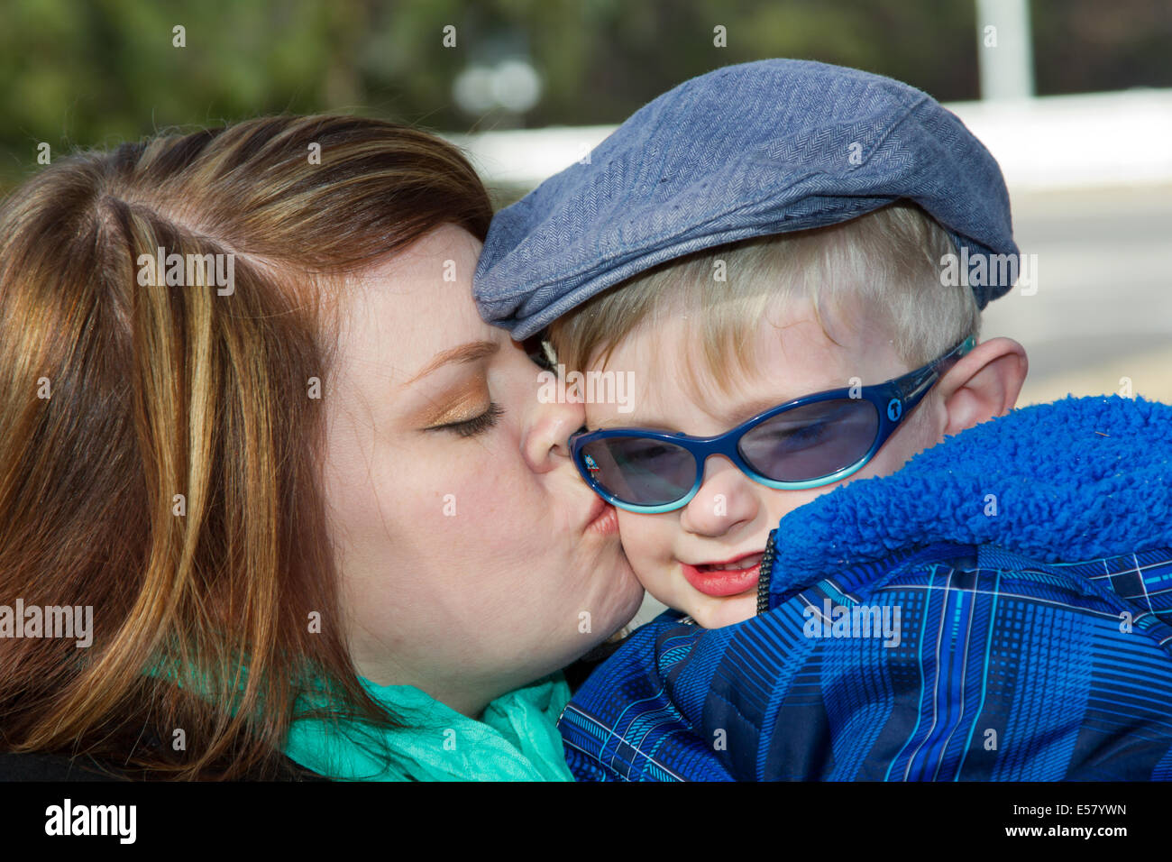 Mother kissing son Stock Photo - Alamy