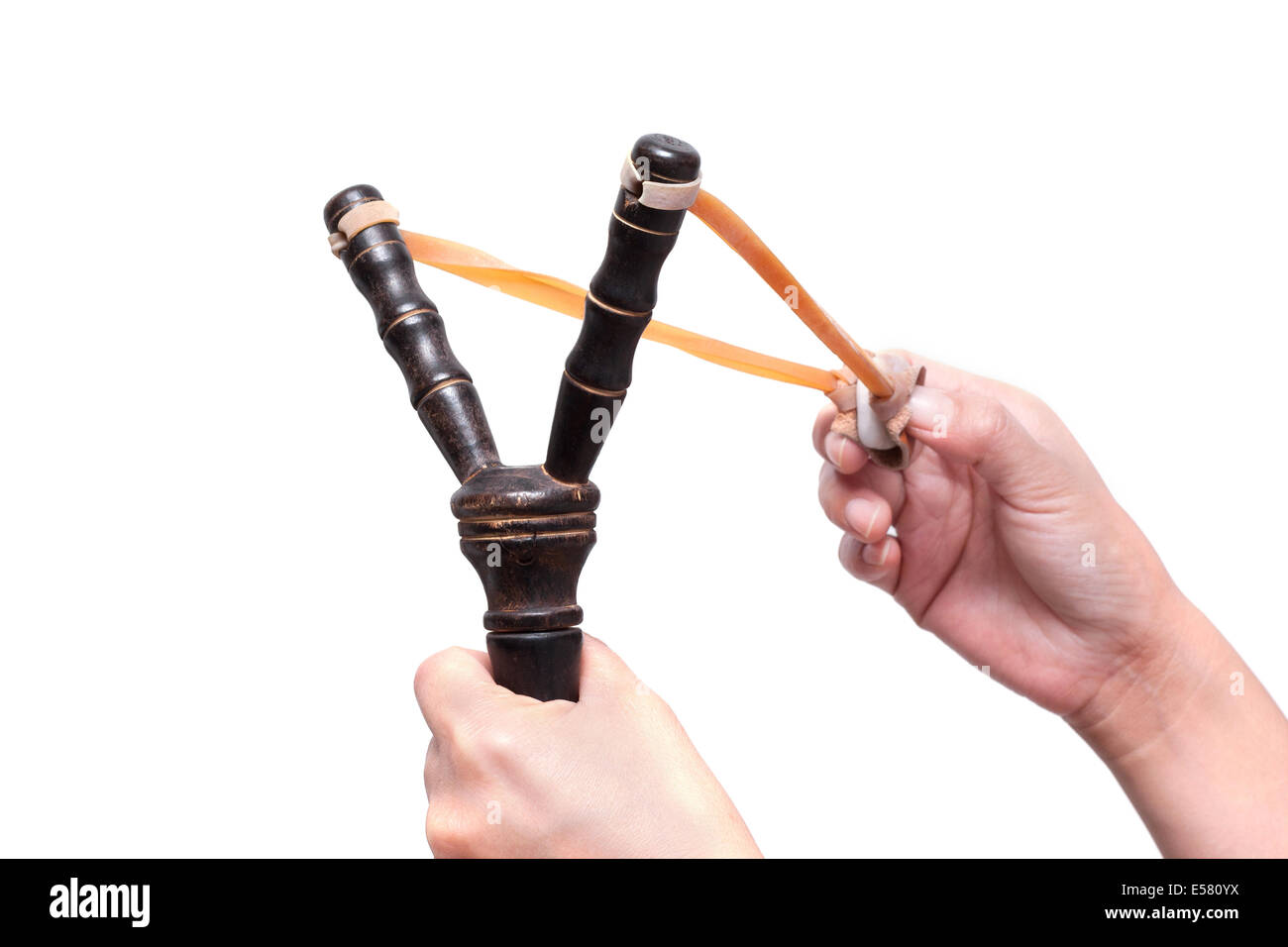 Hand Holding Aiming Slingshot isolated on white background Stock Photo