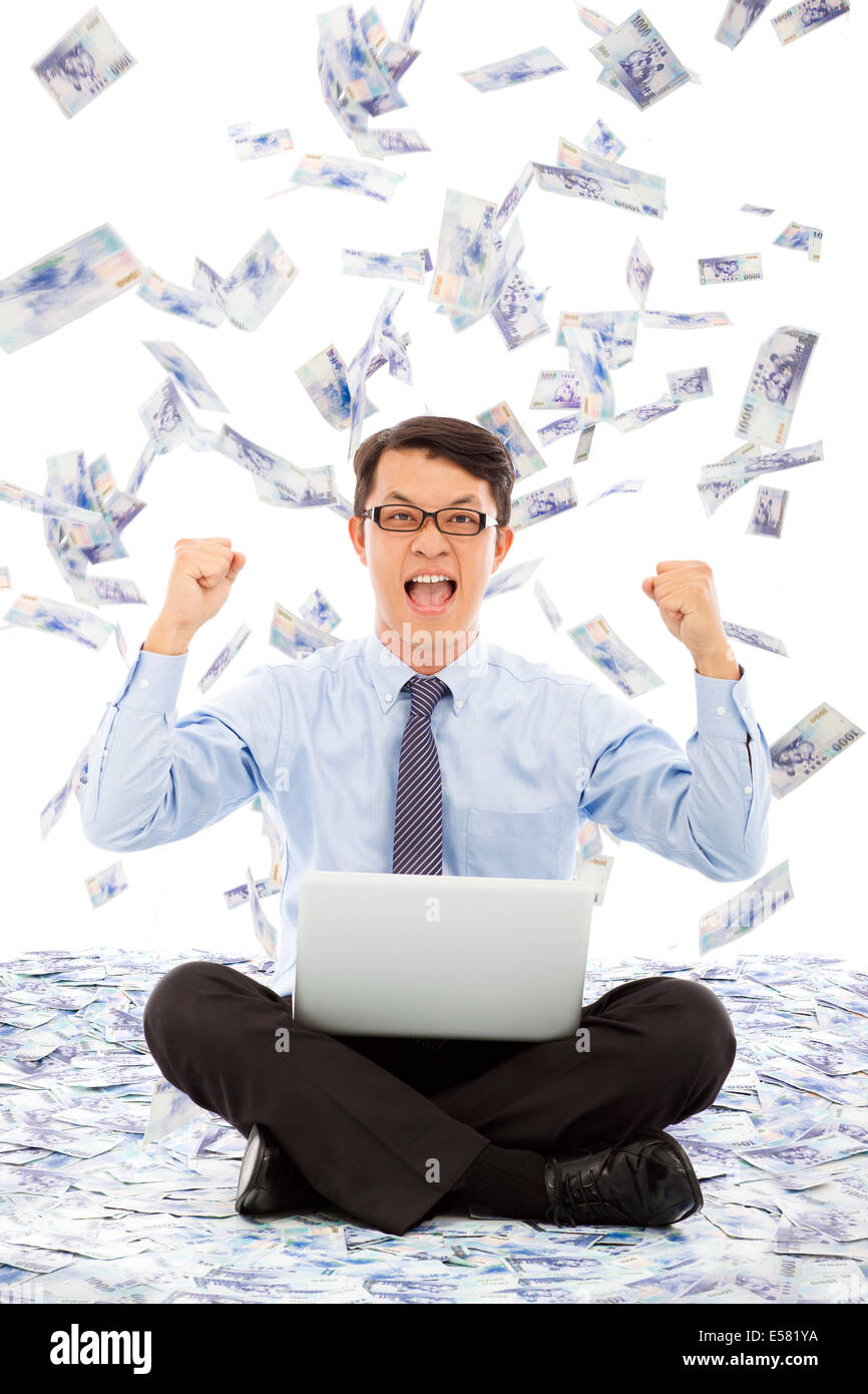 business man make a victory gesture with money rain Stock Photo