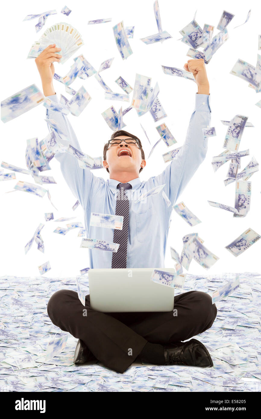 business man winning a lottery with money rain background Stock Photo