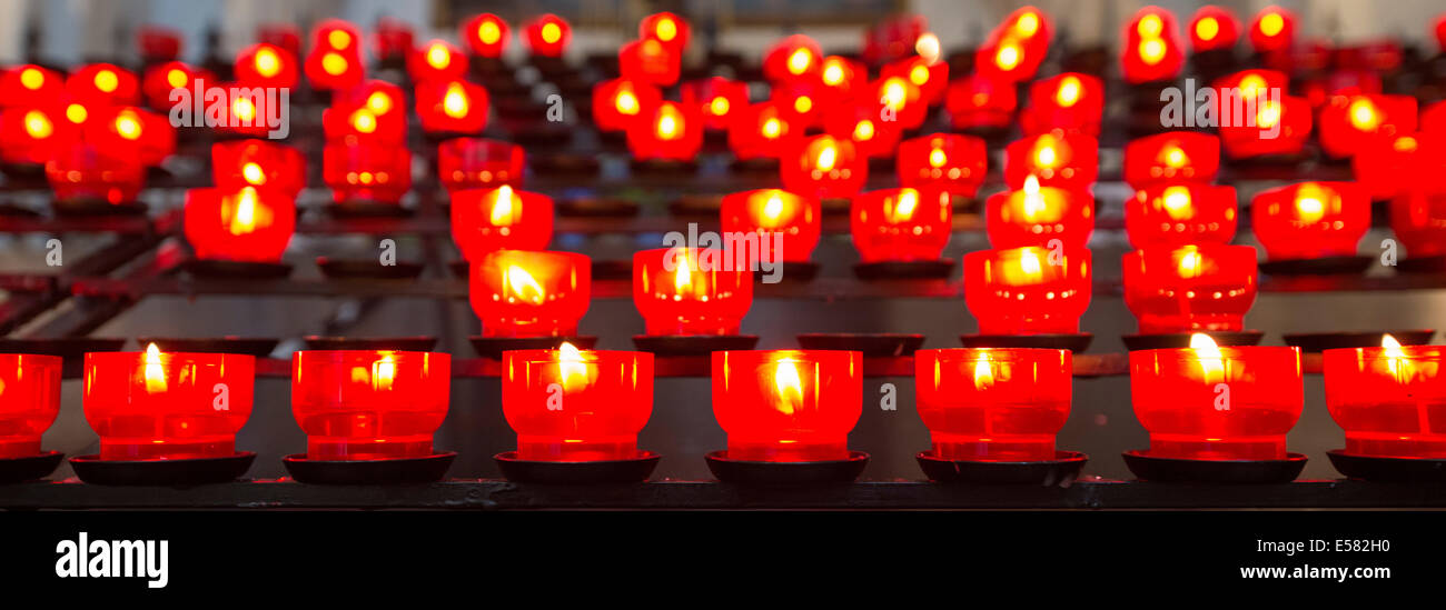 Burning votive candles in a church, Munich, Upper Bavaria, Bavaria