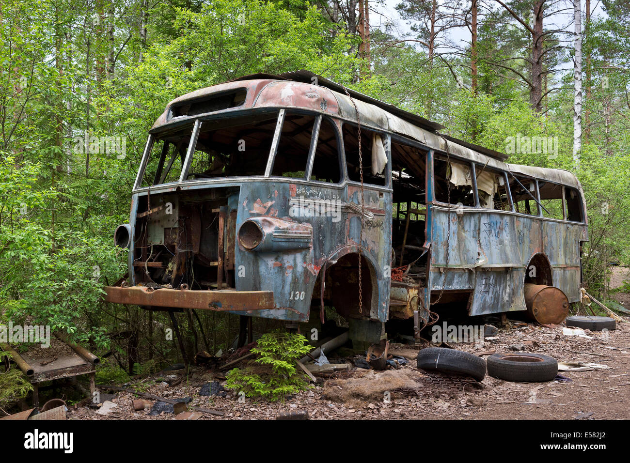 Old bus, Kyrkö Mosse junkyard, Ryd, Tingsryd, Kronoberg County, Sweden Stock Photo