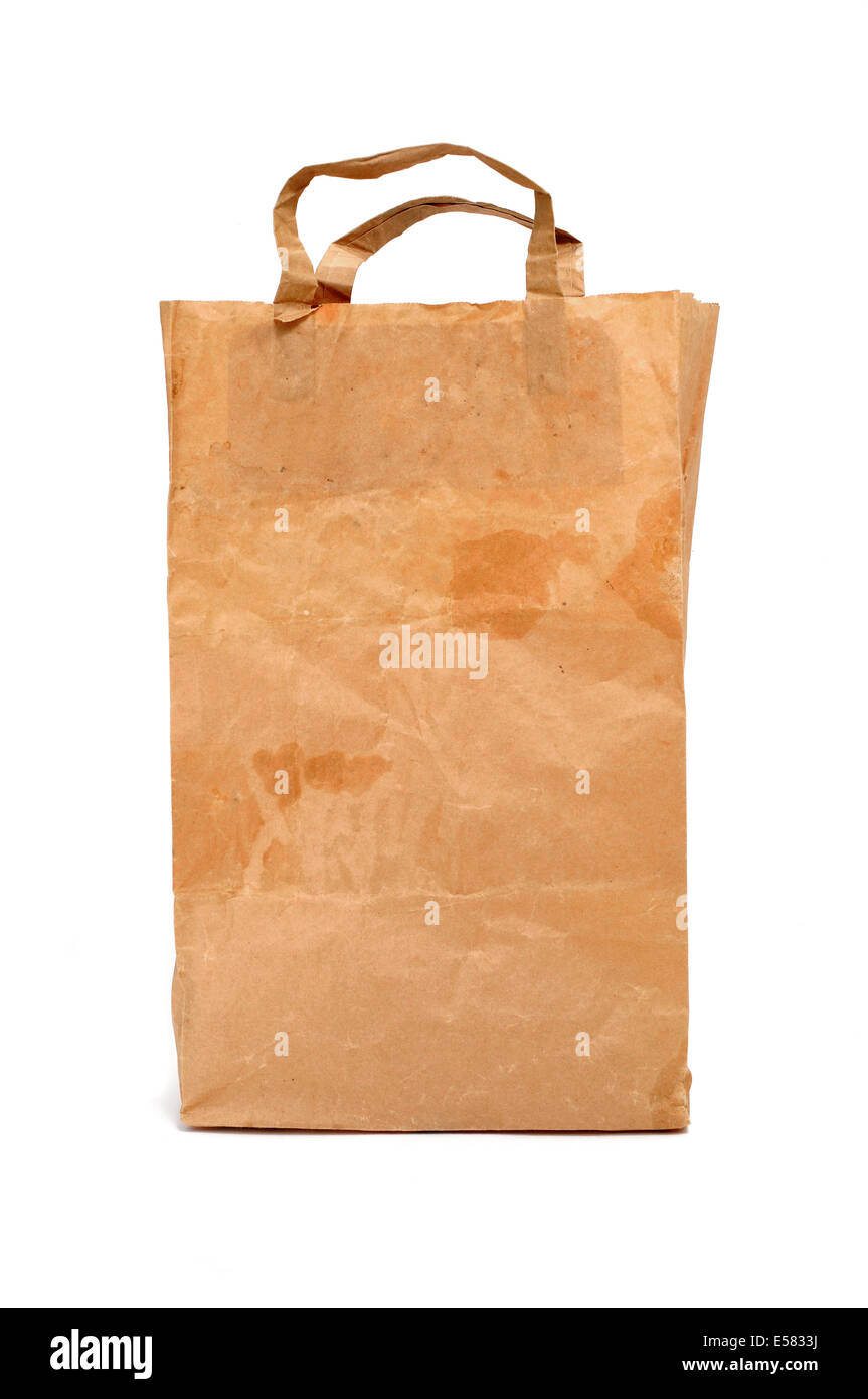 a worn and dirty shopping bag with handles on a white background Stock