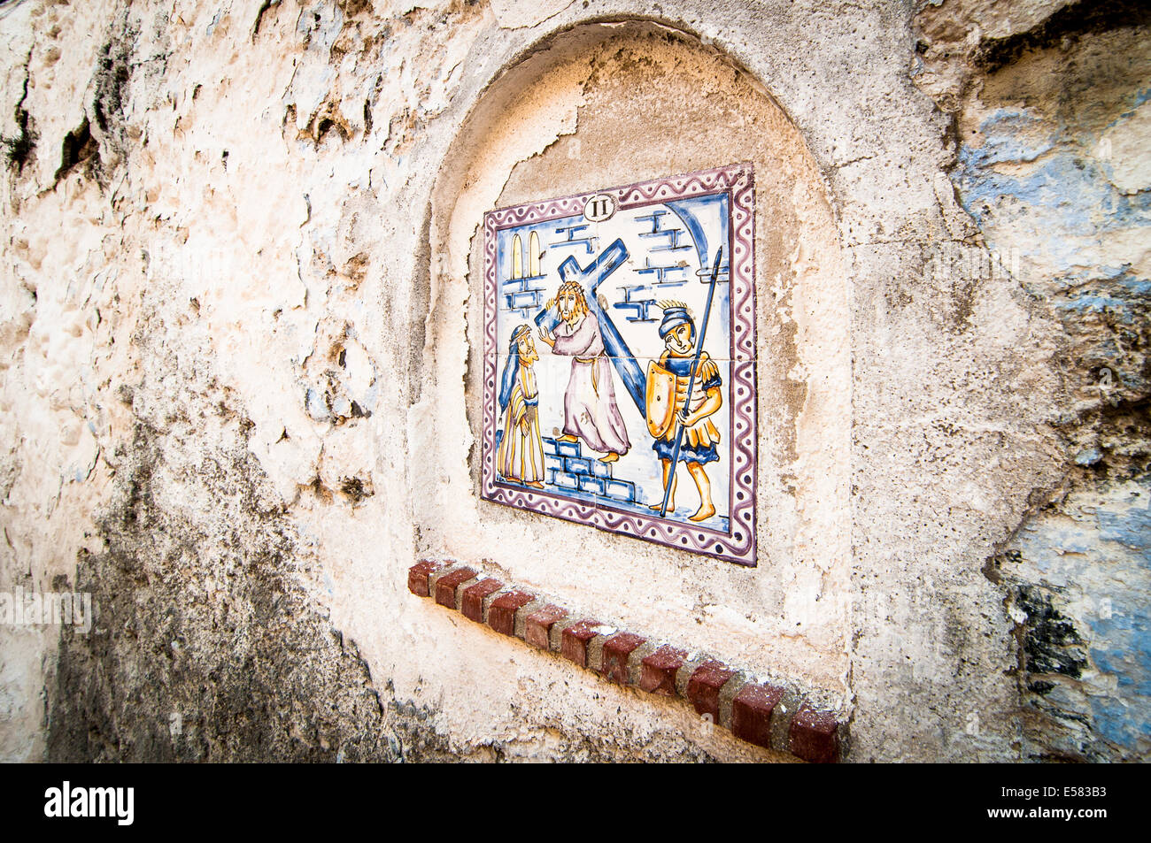 Wall plaque of Christ carrying the cross Stock Photo