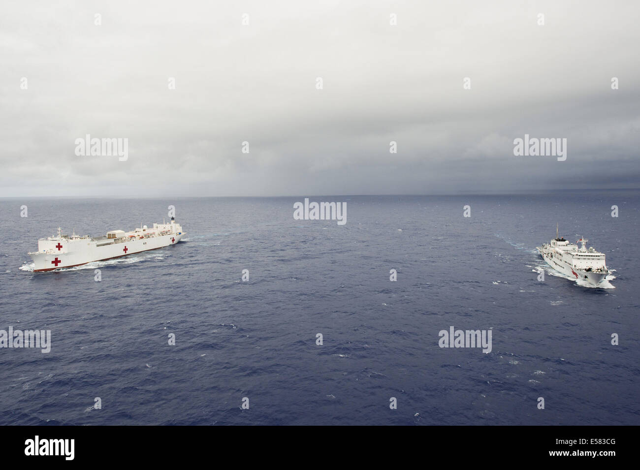 Pacific Ocean. 22nd June, 2014. China's hospital ship Peace Ark (R) and USNS Mercy hospital ship are seen during the Rim of the Pacific (RIMPAC) multinational naval exercises on June 22, 2014. © Qin Haishi/Xinhua/Alamy Live News Stock Photo