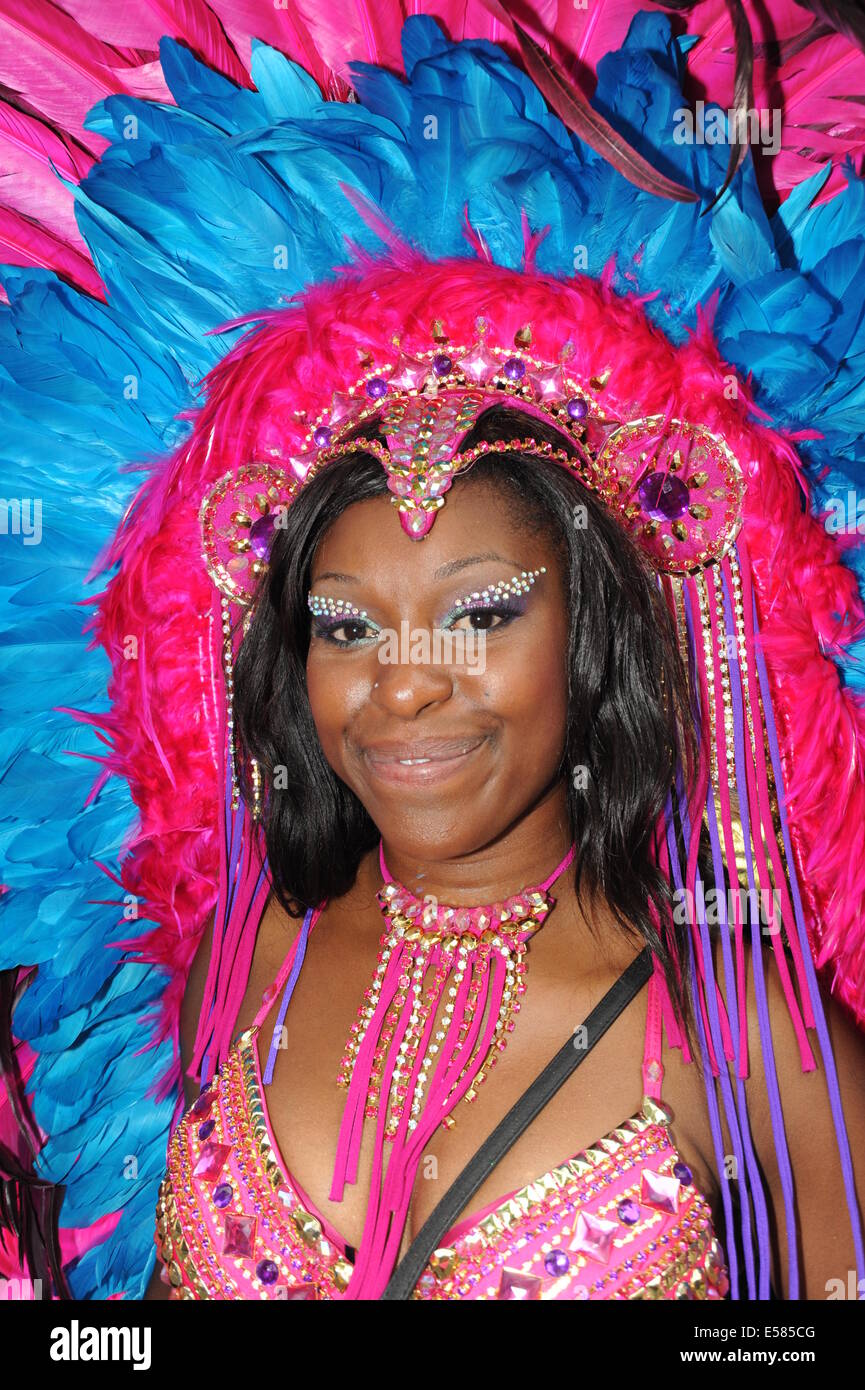 Photograph of a Black women at Notting hill Carnival wearing traditional Caribbean headdress Stock Photo