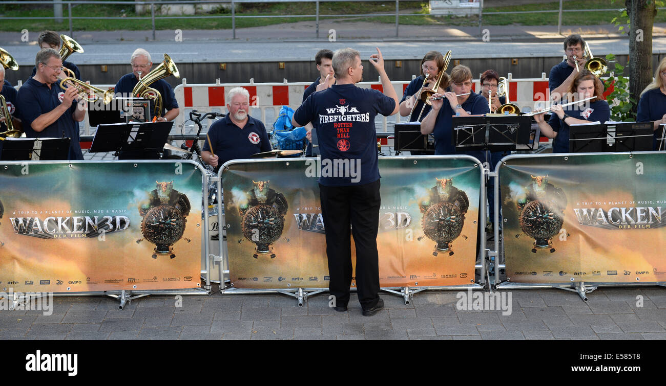 Hamburg, Germany. 22nd July, 2014. The brass band 'Firefighters' plays at the redcarpet during the arrival of premier guests during the premier of the movie 'Wacken 3D' in Hamburg, Germany, 22 July 2014. The film about the Heavy Metal festival Wacken will come to cinemas on 24 July 2014. Photo: DANIEL REINHARDT/dpa/Alamy Live News Stock Photo